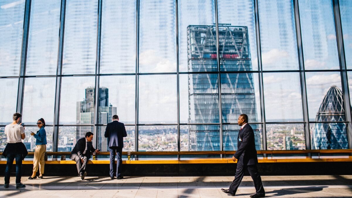 a businessman walking in front of a window