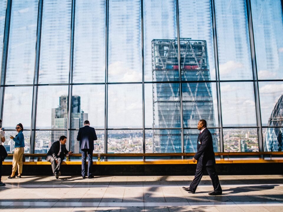 a businessman walking in front of a window