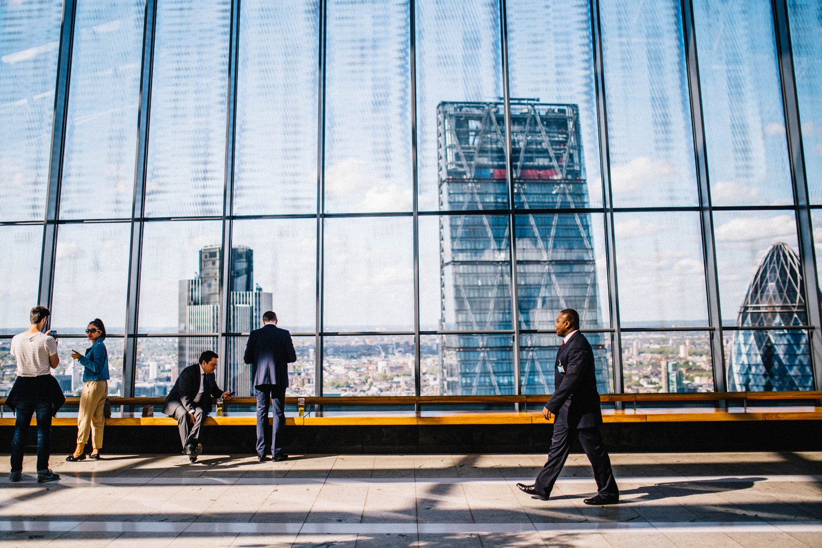 a businessman walking in front of a window